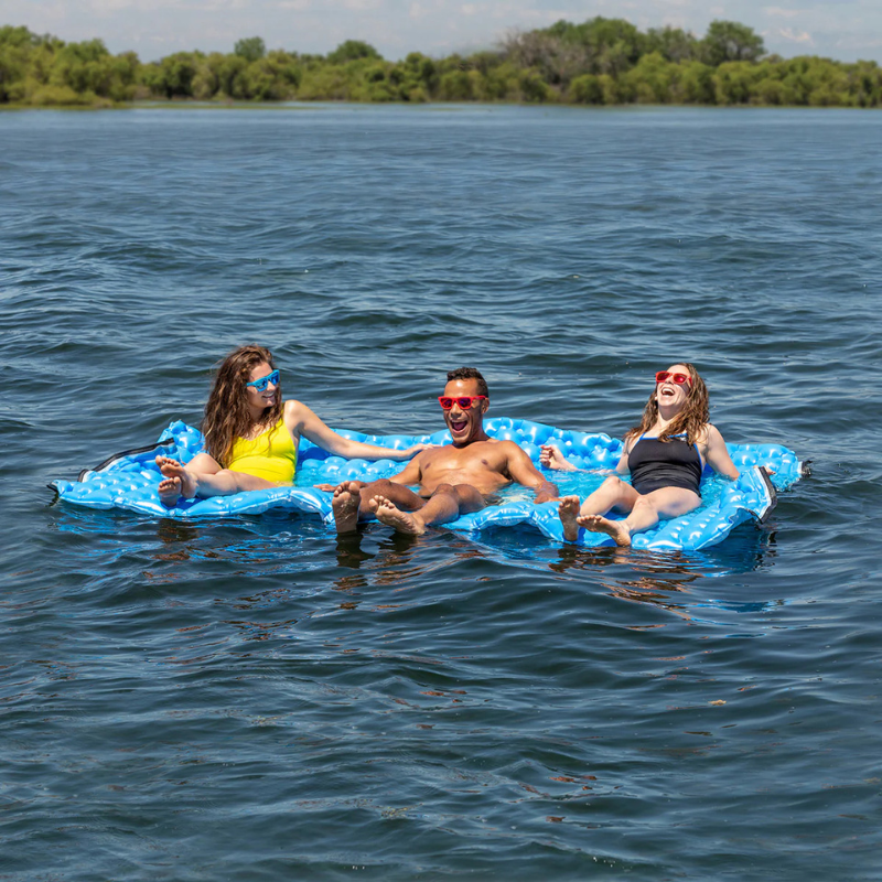 3 People relaxing on a Airhead Air Island 10'x6' Large Inflatable Lake Float | Water Mat - Blue 
