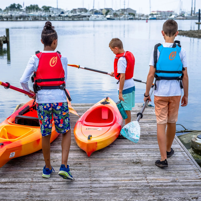 3 children wearing Old Town Inlet Jr Foam Life Jackets for Kids 