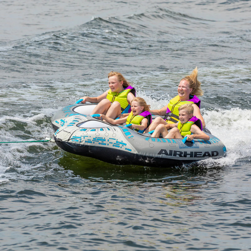 4 people riding Airhead Quadra Cruiser Inflatable Towable Tube