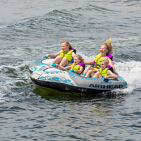 Thumbnail for 4 people riding Airhead Quadra Cruiser Inflatable Towable Tube