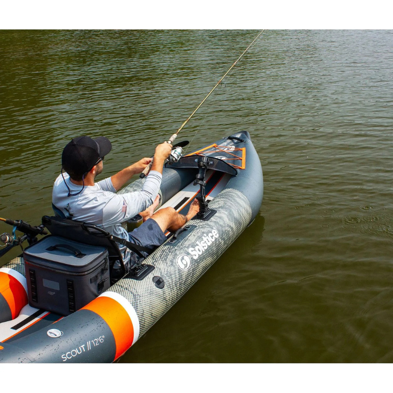 A Man Fishing on a Solstice 12'6" Scout 1-2 Person Inflatable Fishing Kayak