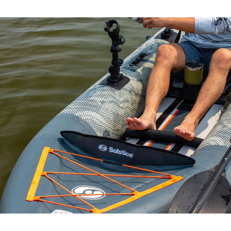 A Man Sitting on a Solstice 12'6" Scout 1-2 Person Inflatable Fishing Kayak 
