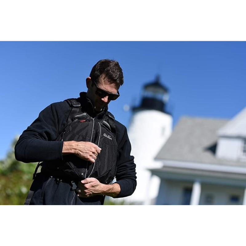 A Man wearing Old Town Solitude II Men's Foam Life Jacket - Black