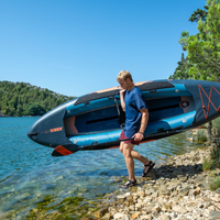 Thumbnail for A man carrying a Gama Inflatable Kayak Package Teal