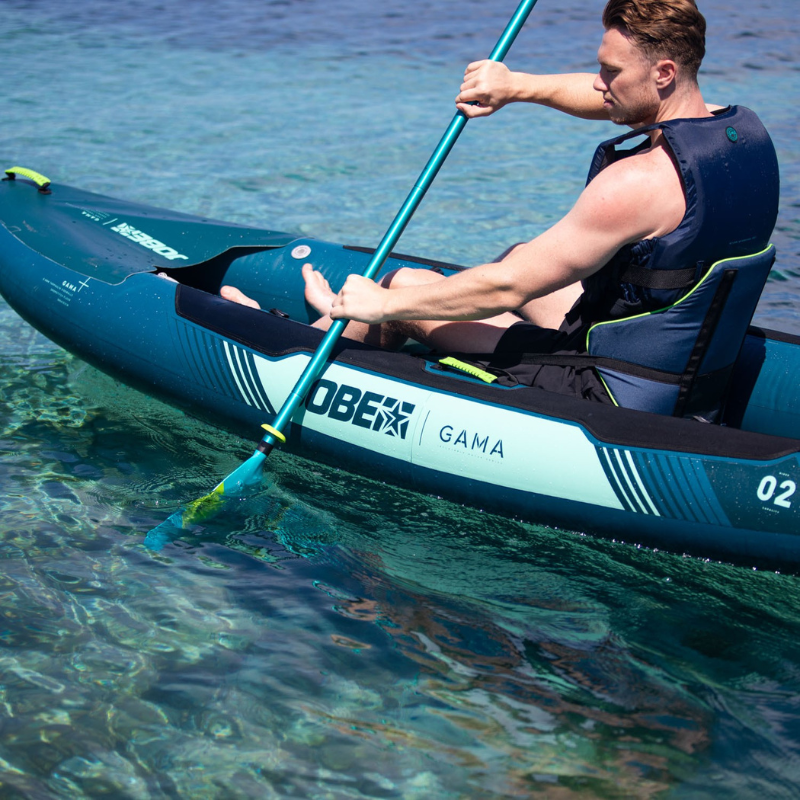 A man rowing a Gama Inflatable Kayak Green