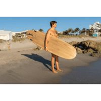 Thumbnail for A beginner surfer with a Surfboard Trading Co Baby Log EPS Epoxy Surfboard – Paulownia | High-Volume Beginner Longboard