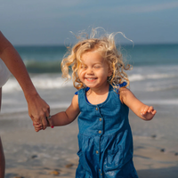 Thumbnail for A child after using Badger SPF 35 Kids 0.65 oz Mineral Sunscreen Face Stick