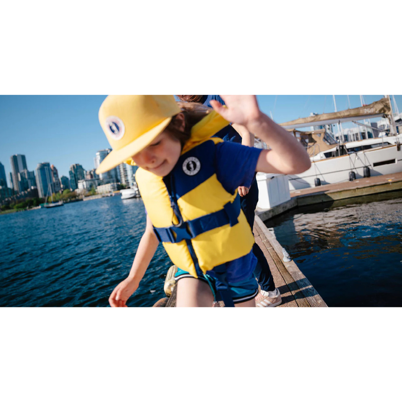 A child in a Mustang Survival Lil Legends Child Life Vest
