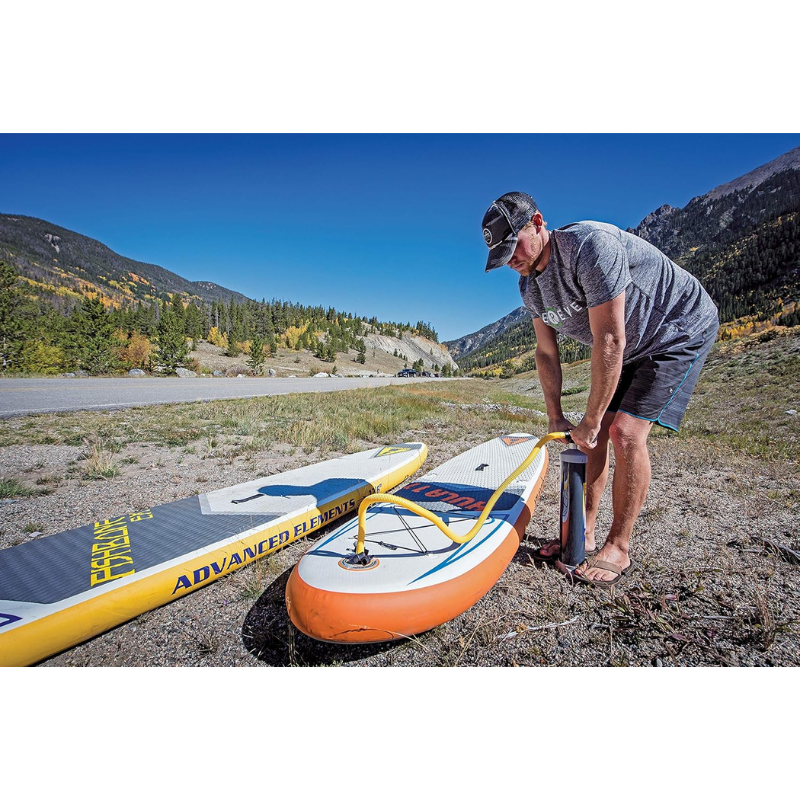 A man Pumping a Advanced Elements 11' Hula Inflatable Paddle Board SUP
