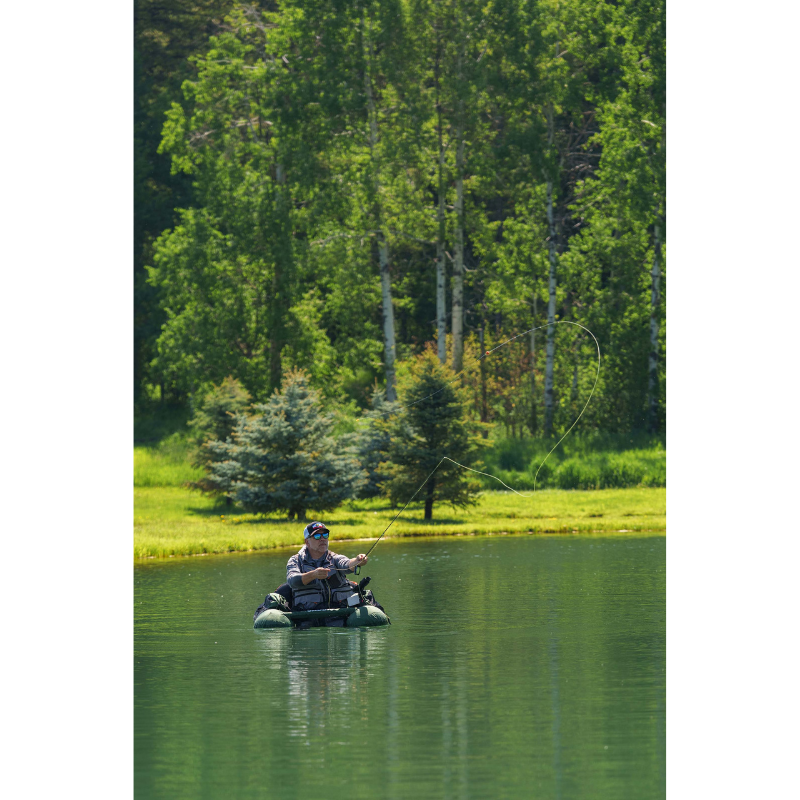 A man riding a green Caddis Sports Nevada 46"x42" Float Tube | Inflatable Fishing Boat 