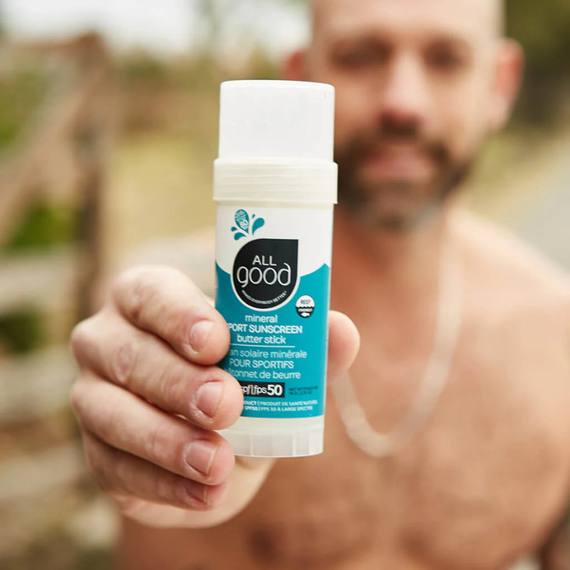 A man showing All Good SPF50 Sport Mineral Sunscreen Butter Stick