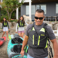 Thumbnail for A man wearing Old Town Riverstream Unisex Foam Life Jacket - Black/Neon