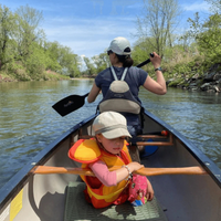 Thumbnail for An woman using Edge Carbon Canoe Paddle and her child is sitting on the canoe with her