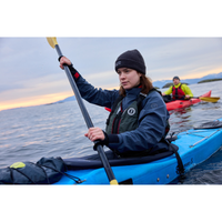 Thumbnail for An woman wearing Mustang Survival L/XL Rebel Women's Foam Life Jacket - Grey and riding a kayak