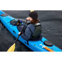 Thumbnail for An woman with a Mustang Survival L/XL Rebel Women's Foam Life Jacket - Grey riding a kayak