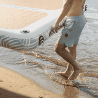 Thumbnail for A person carrying a POP AquaDock 14' × 7' Inflatable Floating Dock