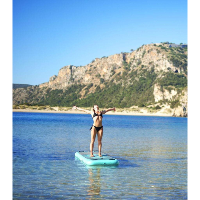 A person on Aqua Marina 8’2” Peace 2020 Fitness Inflatable Floating Yoga Mat