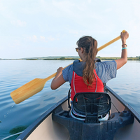 Thumbnail for A person using Propel Paddle Gear by Shoreline Marine 48” Wood Canoe Paddle
