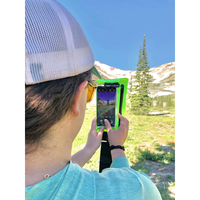 Thumbnail for A person using a phone in a Seattle Sports E‑Merse NeoBelt Waterproof Phone Case - Green