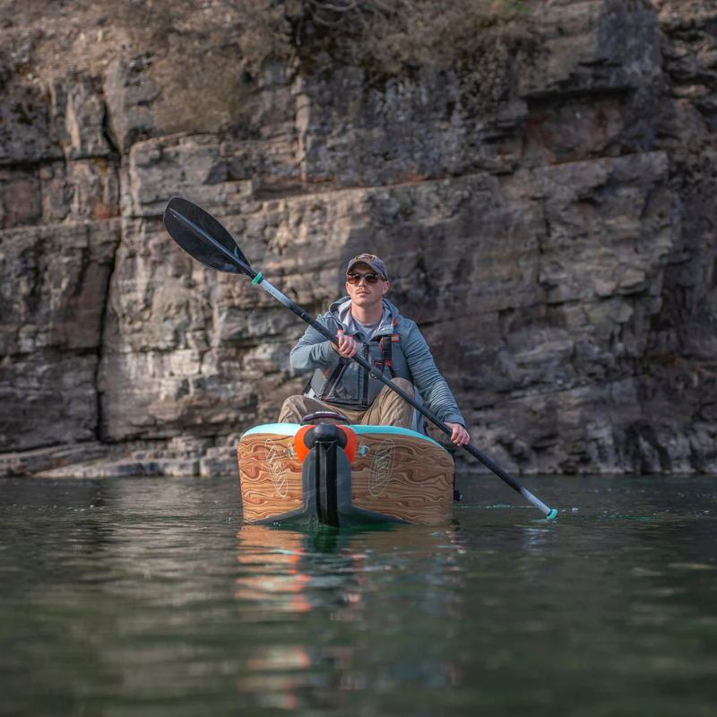 A person wearing a Onyx MoveVent Dynamic Foam Life Jacket – Orange