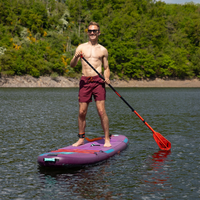 Thumbnail for A smiling man on a Jobe Aero Yarra 10’6” Inflatable Paddle Board iSUP Purple