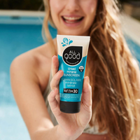 Thumbnail for A smiling person holding All Good SPF30 Tinted Mineral Sunscreen