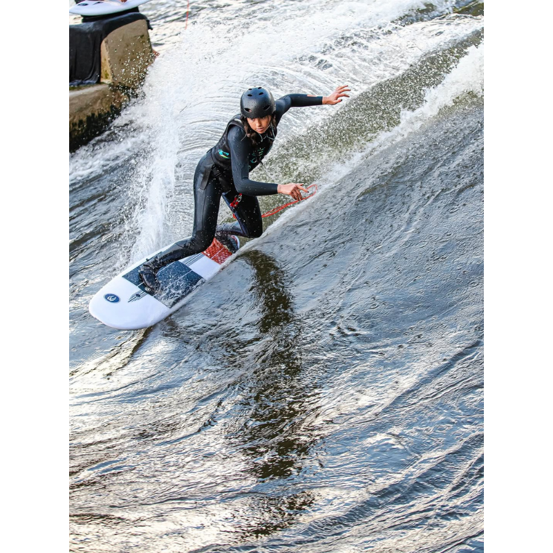 A surfer catching a small wave on Badfish Stylemaster 5'0" River Surfboard | 27L V-Bottom Hybrid Shortboard