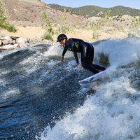 Thumbnail for A surfer catching a wave on Badfish Whiskey Throttle 4'8