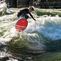 Thumbnail for A surfer on a Badfish Bomb Drop 5' River Shortboard