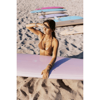 Thumbnail for A surfer with a STC Baby Log Epoxy Surfboard – Lavender | Beginner-Friendly Mid / Mini Longboard