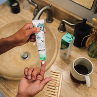 Thumbnail for Badger 1.7 oz SPF30 Face Mineral Sunscreen Lotion on a finger