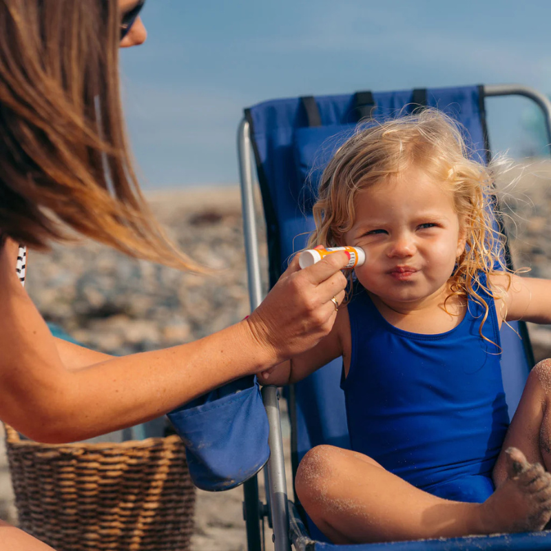 Badger SPF 35 Kids 0.65 oz Mineral Sunscreen Face Stick being applied on a child's face