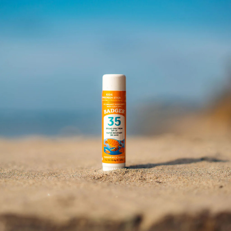 Badger SPF 35 Kids 0.65 oz Mineral Sunscreen Face Stick on the ground