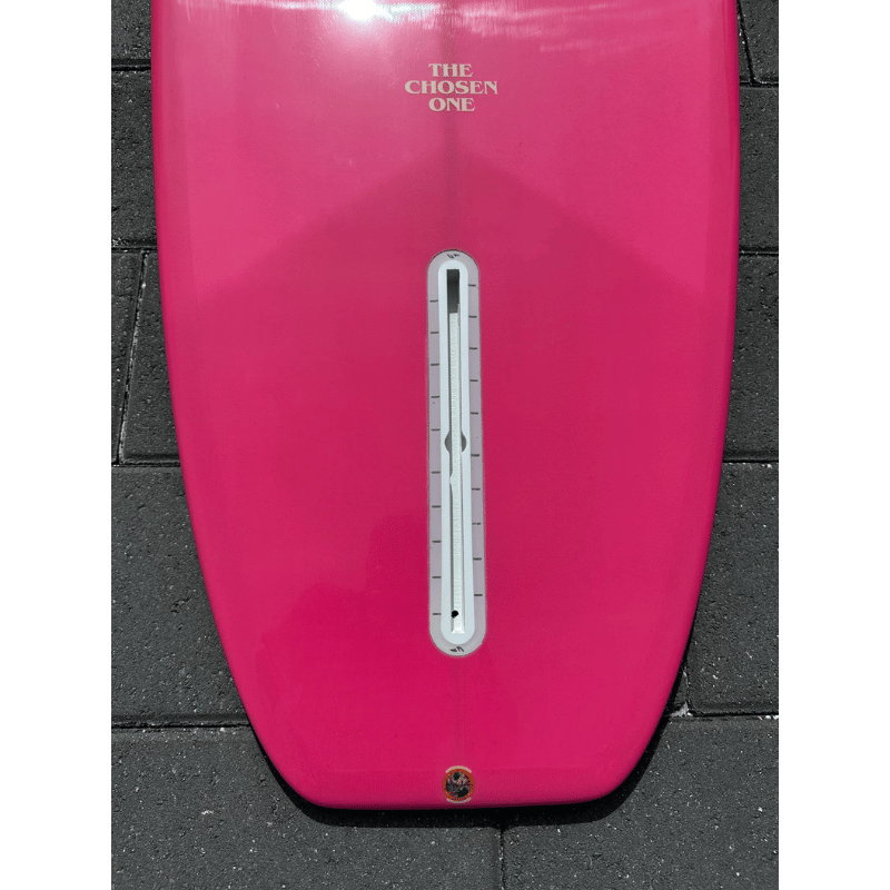 Closeup of a Surfboard Trading Co. Chosen One Noserider Surfboard – Hot Pink | High-Performance Longboard Bottom