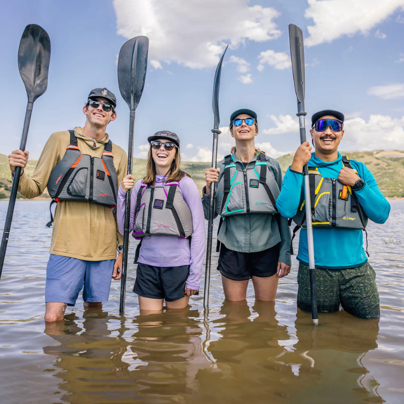 Four People wearing Onyx MoveVent Dynamic Foam Life Jacket of different color