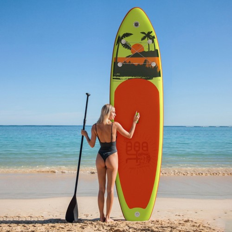 yellow inflatable sup at beach