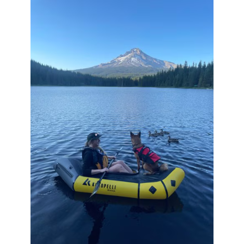 Kokopelli Rogue R-Deck Packraft w/ TiZip – Yellow a girl and a dog