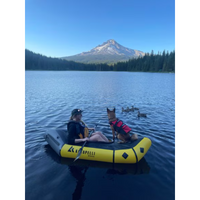 Thumbnail for Kokopelli Rogue R-Deck Packraft w/ TiZip – Yellow a girl and a dog