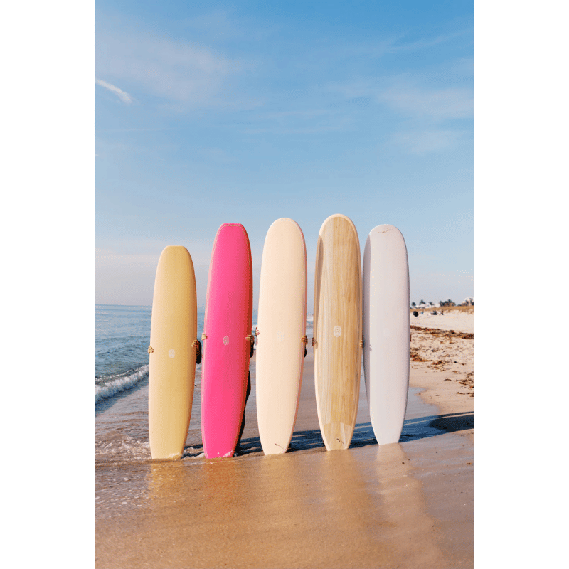 Lifestyle image of STC Chosen One Noserider Surfboard – Hot Pink Longboard