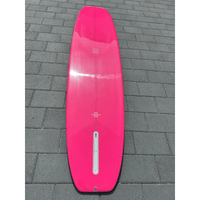 Thumbnail for Lifestyle photo of a Surfboard Trading Co. Chosen One Noserider Surfboard – Hot Pink Longboard Bottom