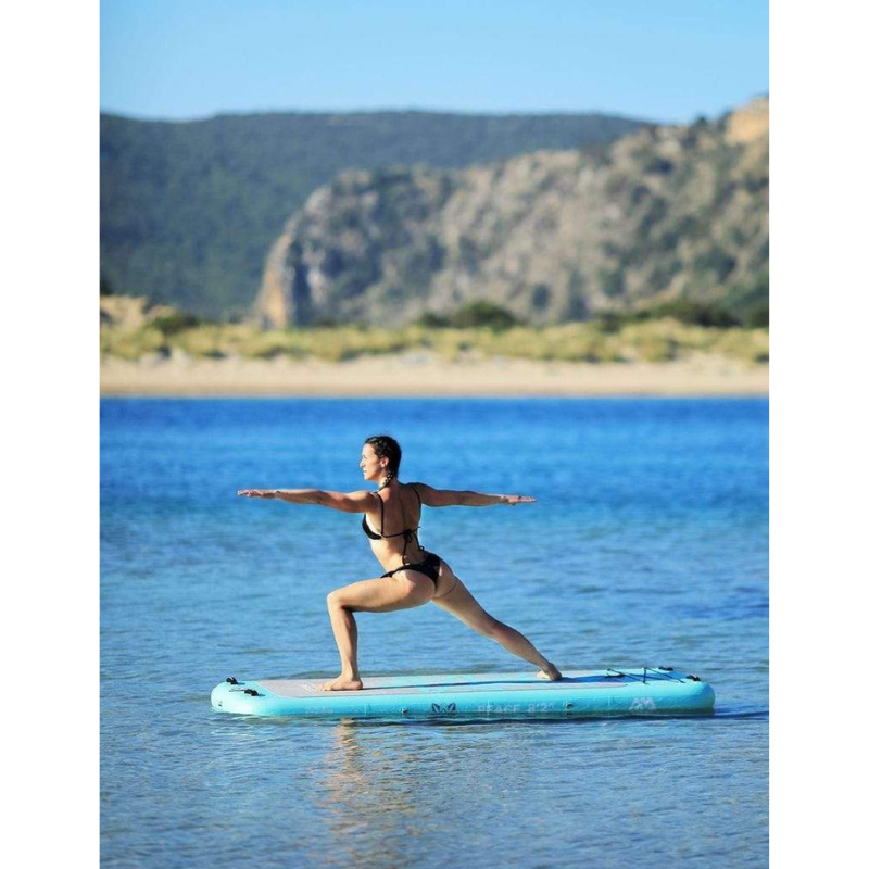Side view of a person on Aqua Marina 8’2” Peace 2020 Fitness Inflatable Floating Yoga Mat