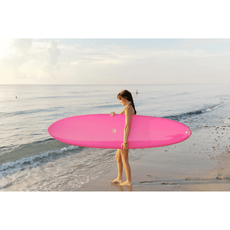 Surfboard Trading Co. ANY DAY Mid Length EPS Surfboard Hot Pink Lifestyle Image