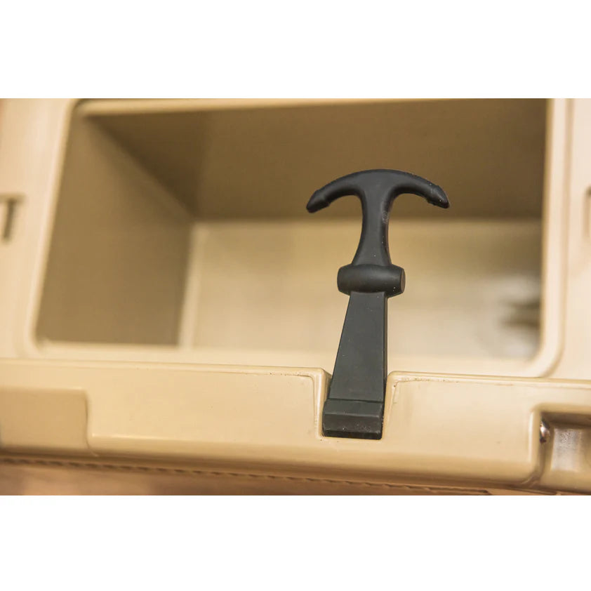 Black tool on a beige metal surface
