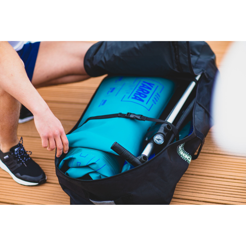 a SUP and pump in a black Jobe Aero Inflatable Paddle Board SUP Travel Bag 
