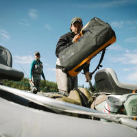 Thumbnail for a man carrying an orange SealLine PRO Zip 40L Dry Duffle Bag