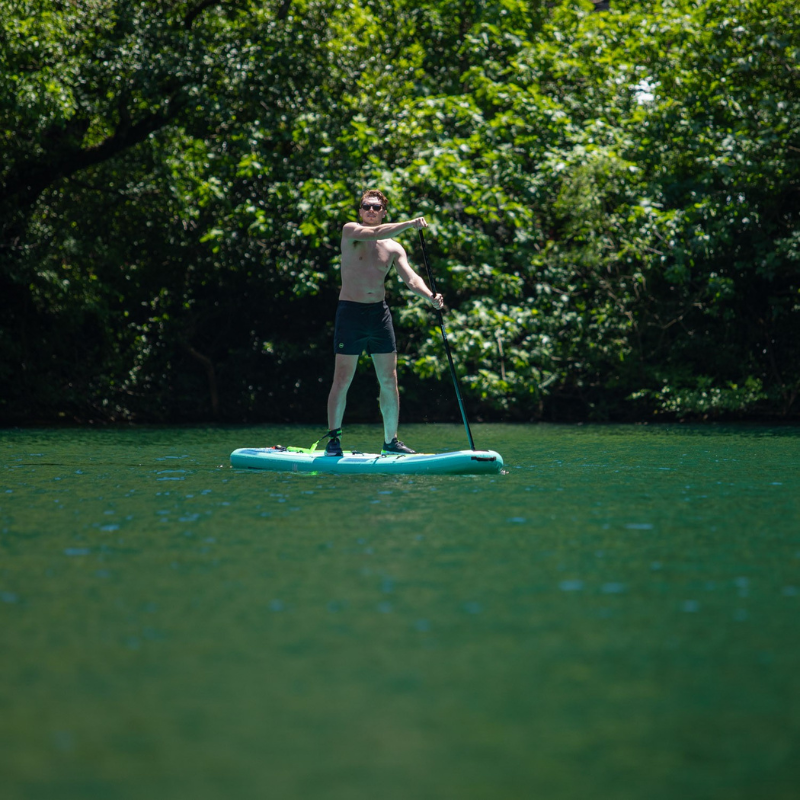 a man on a Aero Loa 11’6” Inflatable Paddle Board iSUP
