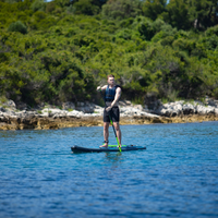 Thumbnail for a man riding Jobe Aero Duna 11’6” blue Inflatable Paddle Board iSUP