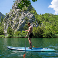 Thumbnail for a man riding Jobe Aero Varna 11’ Inflatable Paddle Board iSUP