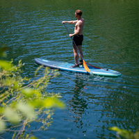 Thumbnail for a man riding an Aero Varna 11’ Inflatable PaddleBoard iSUP