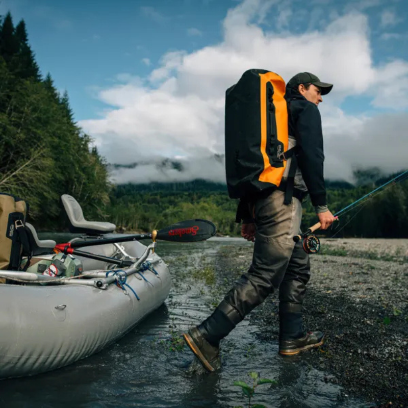 a man with SealLine PRO Zip 40L Dry Duffle Bag — Orange